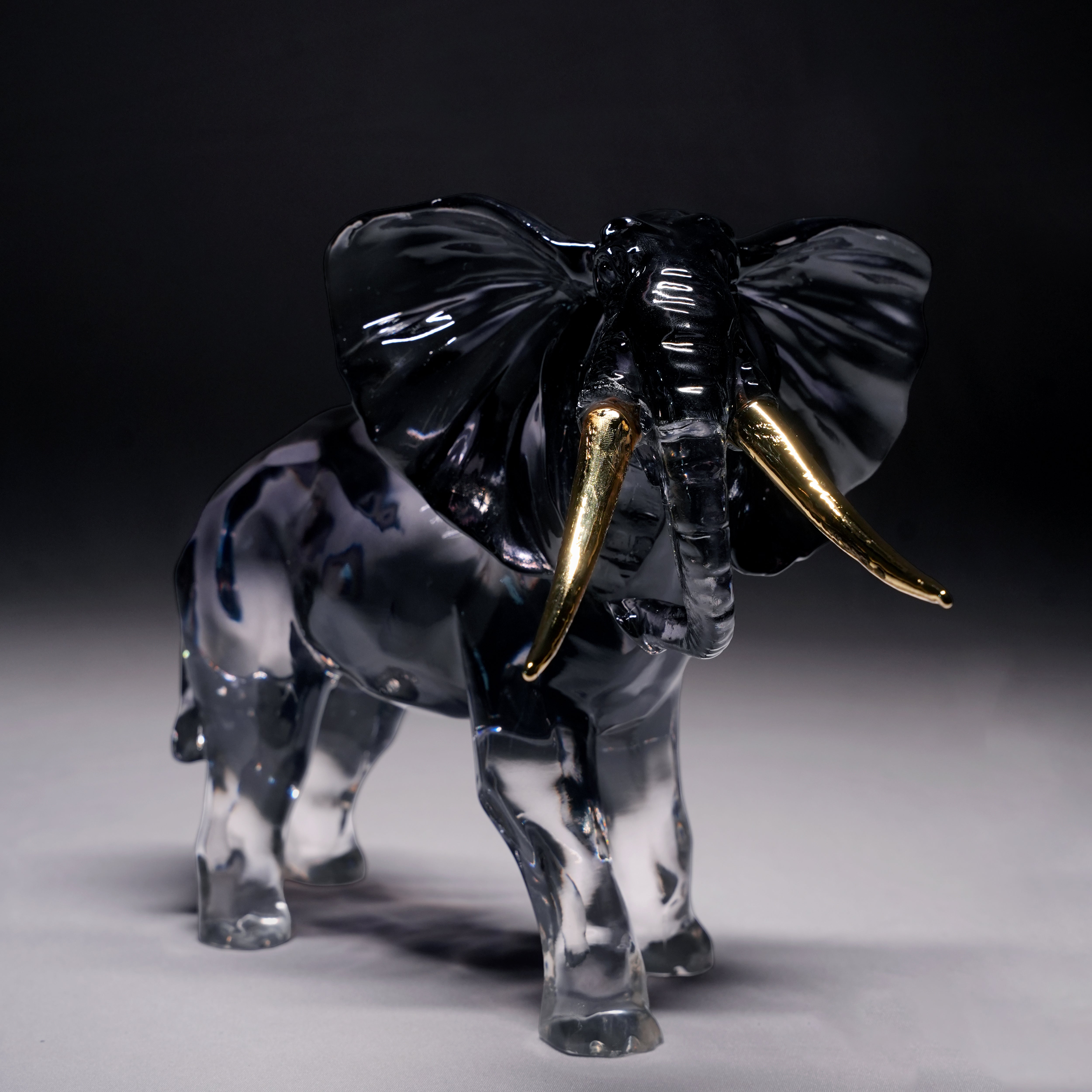 Golden Tusk – Black Resin Elephant Artifact