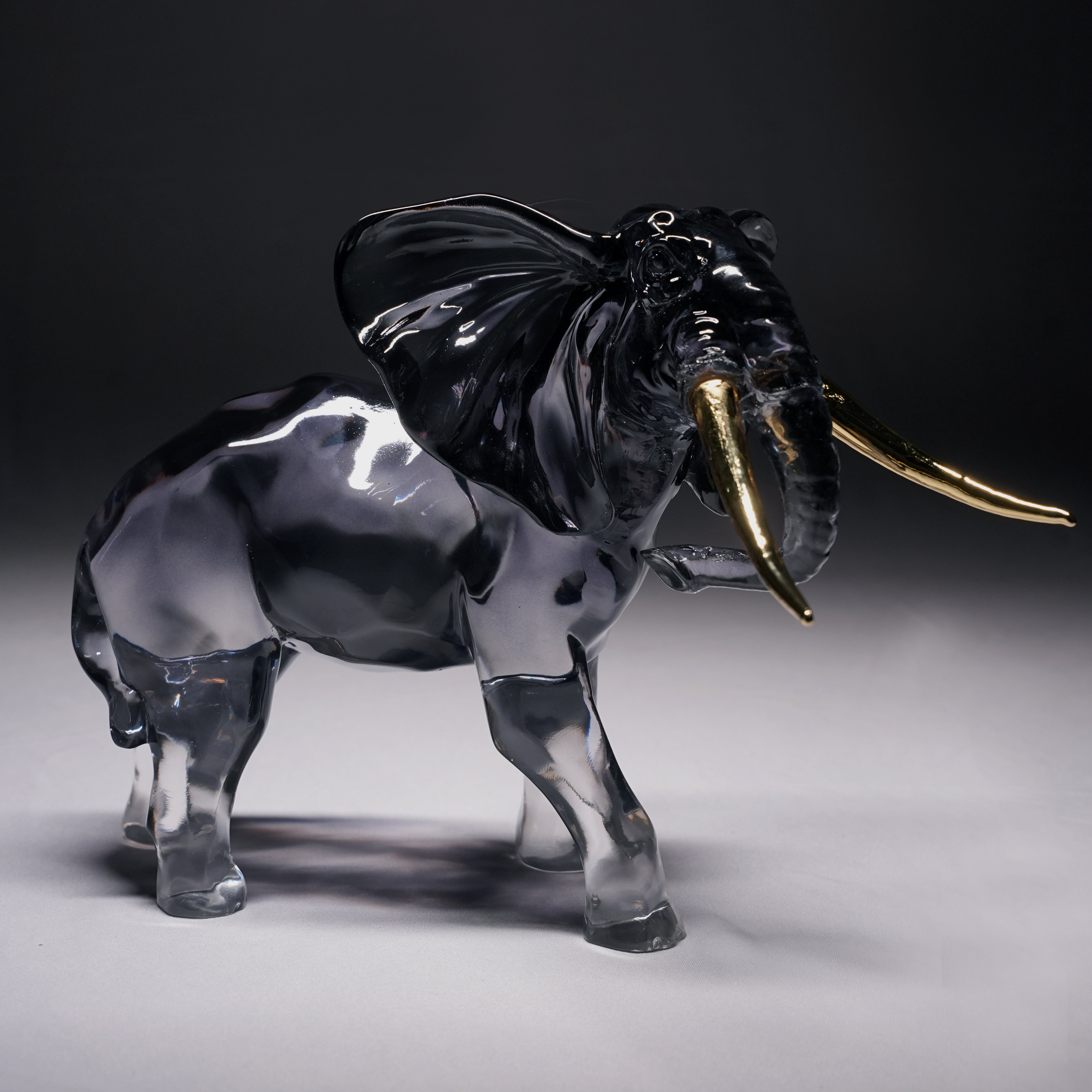 Golden Tusk – Black Resin Elephant Artifact